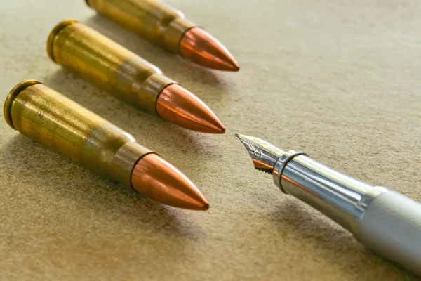 Pen and three bullets — Stock Photo, Image