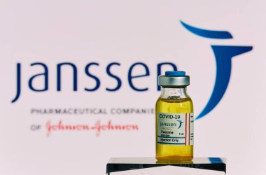 MALLORCA/SPAIN- November 21 2020: Janssen research Coronavirus (Covid 19) vaccine. Row of vaccine bottles with blurred Janssen from Johnson & Johnson company logo on background. clipart