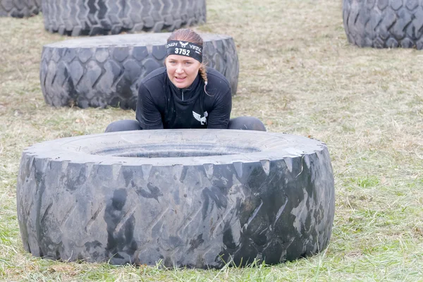 Stockholm Sweden May 2016 Woman Struggling Tip Large Tractor Tire — Stock Photo, Image