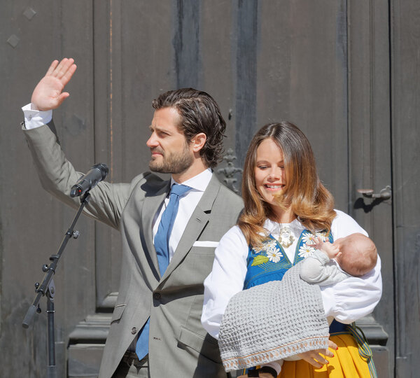 STOCKHOLM, SWEDEN - JUN 06, 2016: The swedish prins Carl Philip Bernadotte smiling and waiving to the audience and princess Sofia Hellqvist holding the newborn baby Alexander