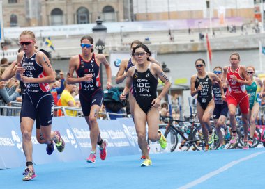 STOCKHOLM - JUL 02, 2016: Group of triathletes running in the transition zone in the Women's ITU World Triathlon series event July 02, 2016 in Stockholm, Sweden