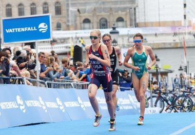 STOCKHOLM - JUL 02, 2016: Group of triathletes running in the transition zone in the Women's ITU World Triathlon series event July 02, 2016 in Stockholm, Sweden