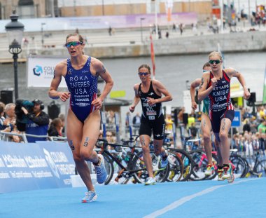 STOCKHOLM - JUL 02, 2016: Group of triathletes running in the transition zone in the Women's ITU World Triathlon series event July 02, 2016 in Stockholm, Sweden
