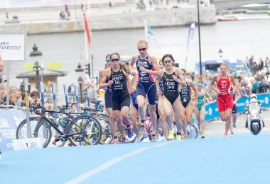STOCKHOLM - JUL 02, 2016: Group of triathletes running in the transition zone in the Women's ITU World Triathlon series event July 02, 2016 in Stockholm, Sweden