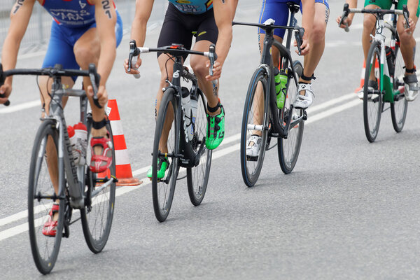 STOCKHOLM, SWEDEN - JUL 02, 2016: Four colorful triathlete bicycles closeup in the Men's ITU World Triathlon series event July 02, 2016 in Stockholm, Sweden