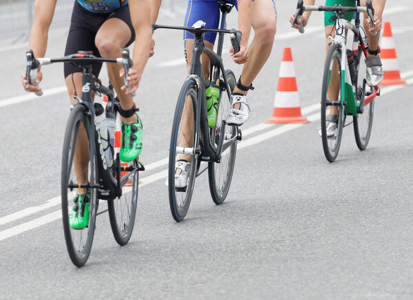 STOCKHOLM, SWEDEN - JUL 02, 2016: Three triathlete bicycles closeup in the Men's ITU World Triathlon series event July 02, 2016 in Stockholm, Sweden