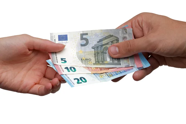 Hand gibt Euro-Banknoten an andere Hand — Stockfoto