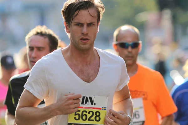 Running focused young man — Stock Photo, Image