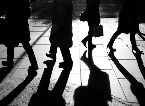 Silhouettes of legs walking — Stock Photo, Image