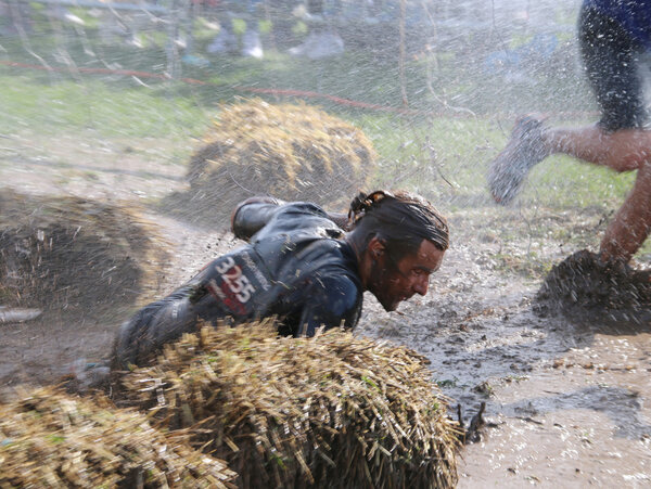 Man has fallen in the mud, squirted with mud and water