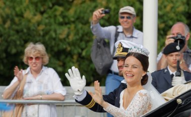 The swedish Prince Carl-Philip Bernadotte and his wife waving an clipart