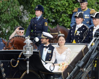 The royal coach carrying the swedish Prince Carl-Philip Bernadot clipart