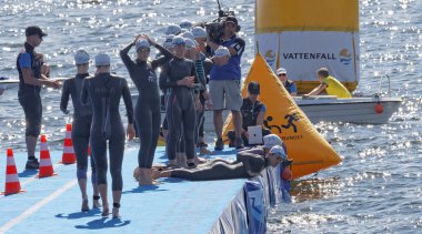 The female swimming competitors warming up