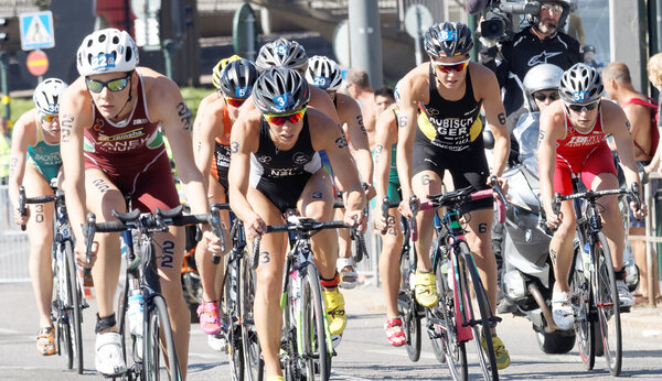 Front view of a group of triathlete cyclists
