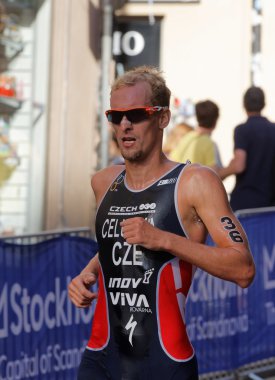 STOCKHOLM, SWEDEN - AUG 23, 2015: Triathlete Jan Celustka running wearing sun glasses in the Men's ITU World Triathlon series event August 23, 2015 in Stockholm, Sweden