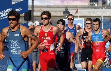STOCKHOLM, SWEDEN - AUG 23, 2015: Close-up of group of running triathletes Fabian, Knabl, Godoy in the Men's ITU World Triathlon series event August 23, 2015 in Stockholm, Sweden