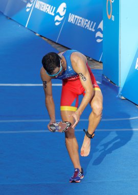 Triathlete Francesc Godoy taking care of an injured foot