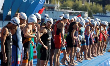 Close-up, male swimming competitors waiting for the start signal clipart