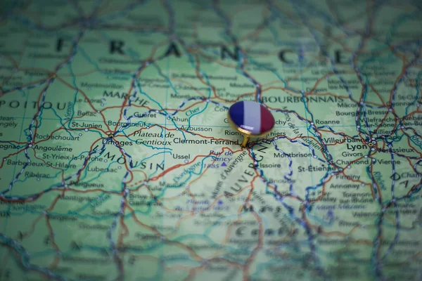 Clermont-Ferrand pinned on a map with the flag of France