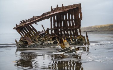 Shipwreck at Fort Stevens State Park in Astoria, Oregon clipart