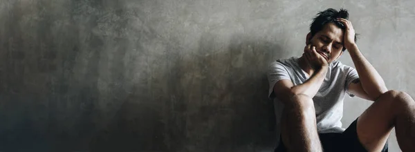 Depressed Strained Young Asian Man Sitting Alone Dark Grey Wall — Stock Photo, Image