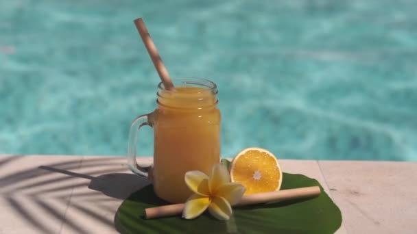 Video Footage Glass Mason Jar Orange Juice Bamboo Straw Half — Stock Video