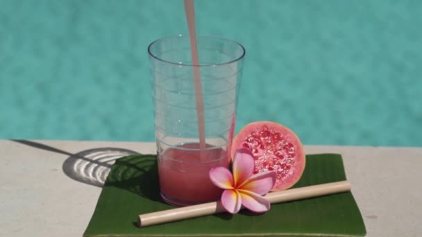 Video Footage Glass Pink Guava Juice Bamboo Straw Half Fresh — Stock Video