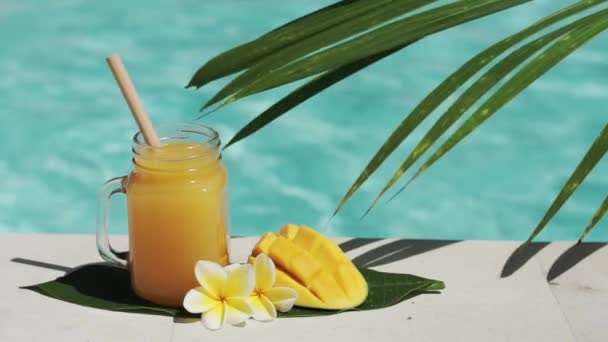 Video Footage Glass Mason Jar Mango Juice Bamboo Straw Half — Stock Video