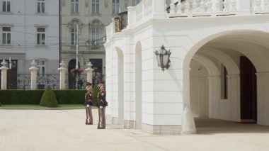 Two soldiers from the Honor Guard of the President of the Slovak Republic stand guard at attention at their posts outside the Grassalkovich Palace.