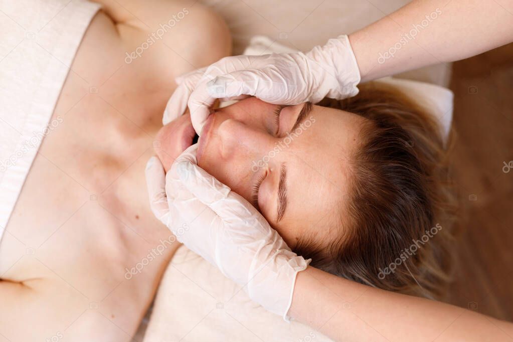woman's book massage. anti-ageing procedures