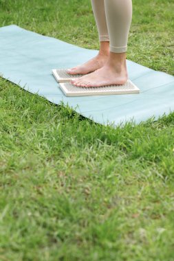 woman with custom Sadhu nail board