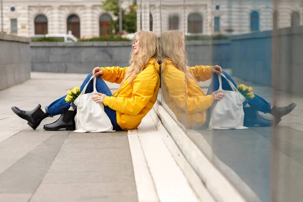 Woman Sits Window Yellow Raincoat — Stock Photo, Image