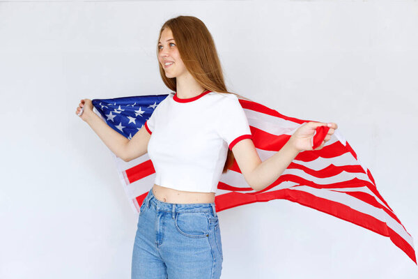 girl with the American flag on a gray background