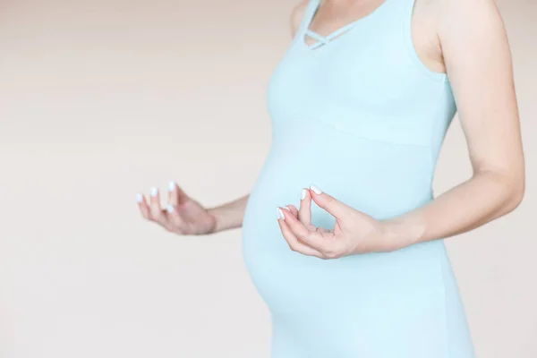 Pregnant Woman Practices Yoga Tight Blue Sports Jumpsuit Light Background — 图库照片