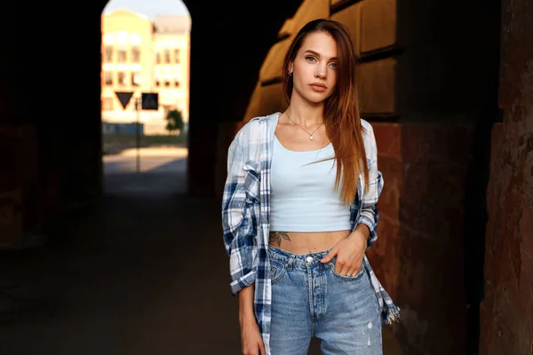 attractive woman in the city of urban style in the evening on a walk