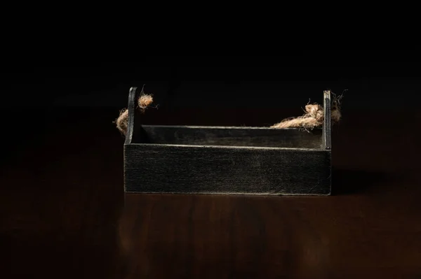 traditional ancient box on wood table with black background