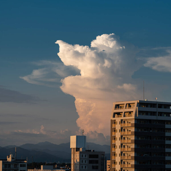 japan skyline scenery with dramatic clouds and beautiful orange dawn in summer