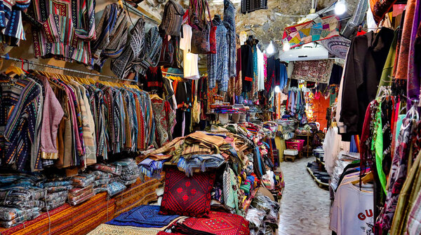 Arab store of bright clothing made of natural fabrics in the shopping malls of Jerusalem