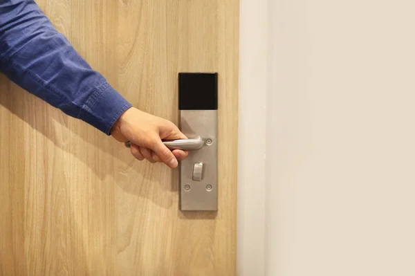 Electronic lock on door.man opening hotel room electronic lock with key card