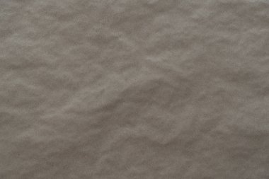 crumpled cream craft paper background texture. closeup