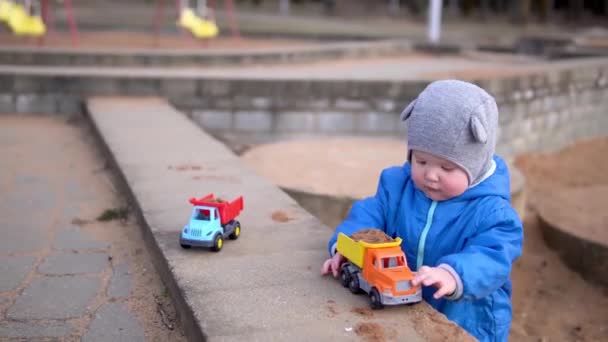 Kid Rolls Typewriter Truck Sand Boy Playing Toy Street — Stock Video