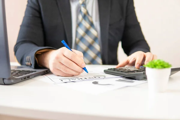 businessman at the table to sign a contract. close-up