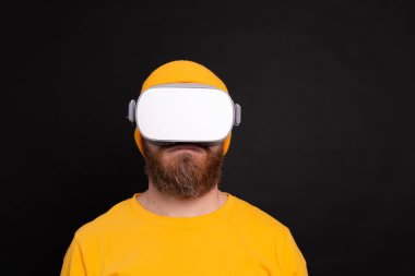Handsome bearded in vr glasses  studio background