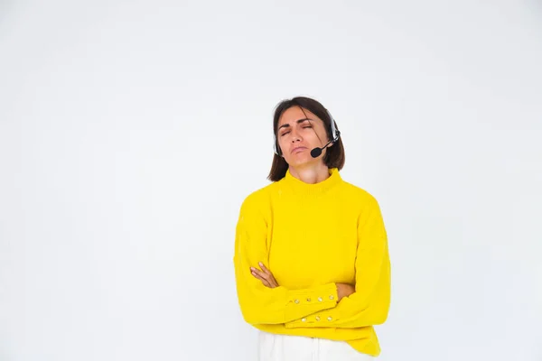 Pretty Woman Yellow Sweater White Background Manager Headphones Unhappy Tired — Stock Photo, Image