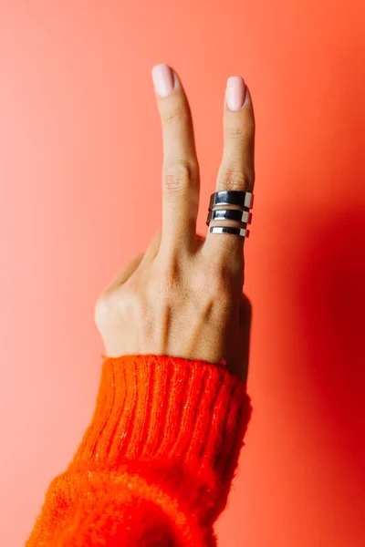 Woman Hand Red Sweater Shows Piece Gesture Sign Ring Finger — Stock Photo, Image