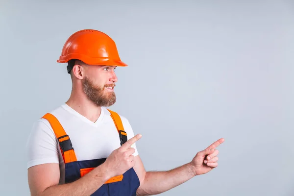 Handsome Man Engineer Building Protective Helmet Gray Background Point Index — Stock Photo, Image