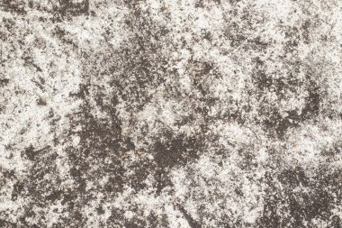 Eskimiş taşa benzeyen pürüzlü toprak dokulu arka plan, kahverengi ve bej renkler, düzensiz lekeler, granüler yüzey ve kırsal yaşlanma görüntüsü.