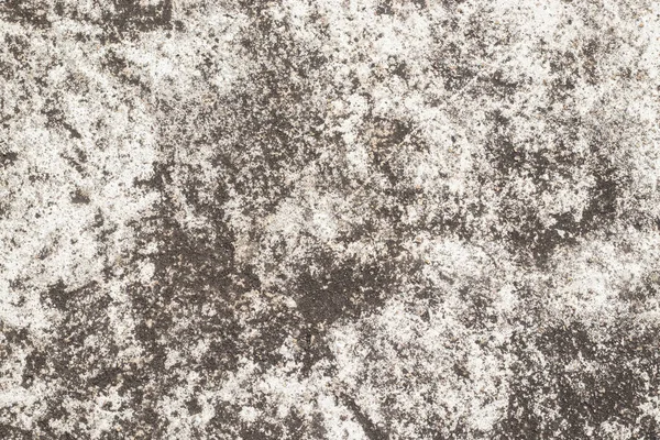 Eskimiş taşa benzeyen pürüzlü toprak dokulu arka plan, kahverengi ve bej renkler, düzensiz lekeler, granüler yüzey ve kırsal yaşlanma görüntüsü.