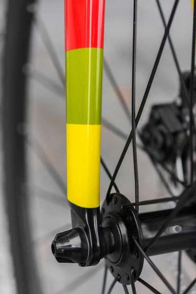 Macro detail of a coloured fixie bike fork — Stock Photo, Image