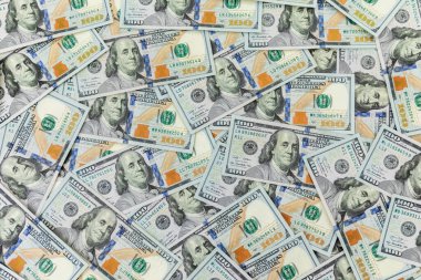 Amerikan dolarıyla desen. Yüz dolarlık banknotların arka planı.